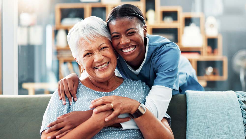 Happy patient smiling with family after All-on-X dental care at Griffith Dental