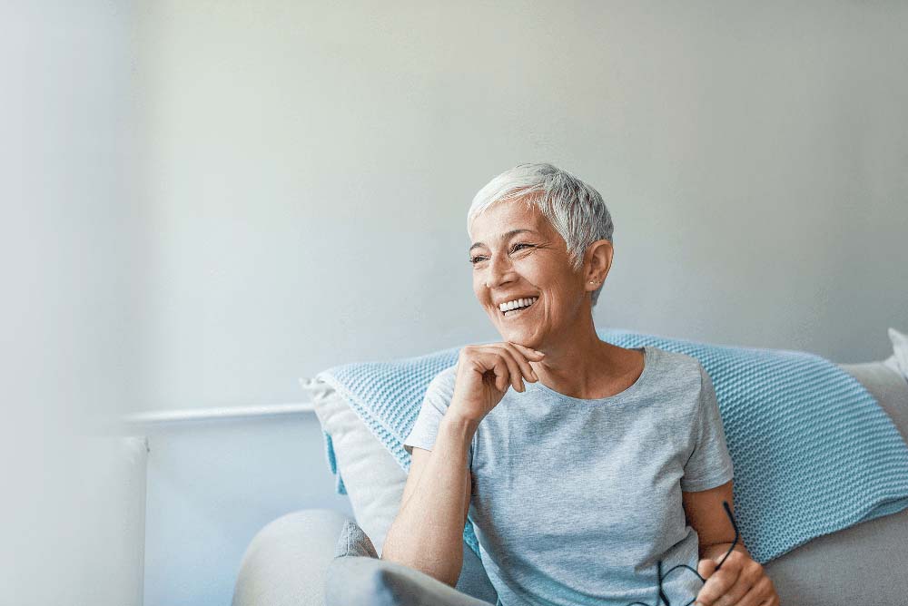 woman smiling comfortably after restorative dental care, CEREC Same Day Crowns in Port Richey FL