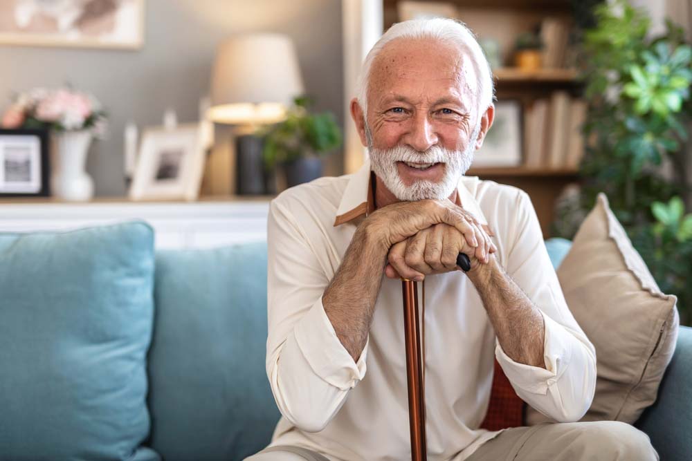 man smiling with restored teeth by Periodontal Therapy at Griffith Dental in Port Richey FL