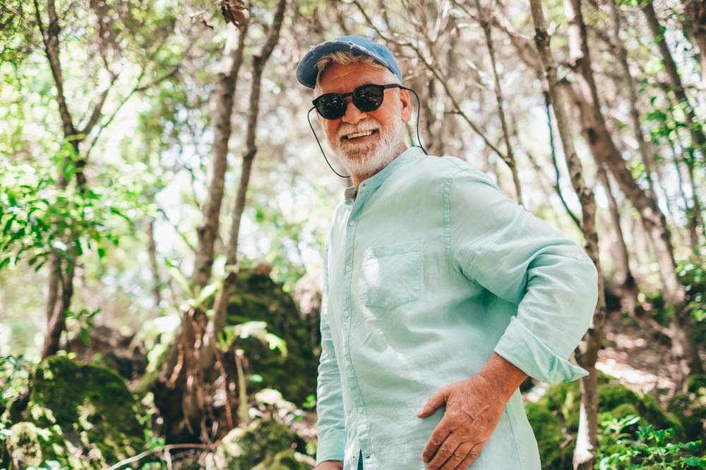 Active man smiling with healthy teeth due to Preventive Care in Port Richey FL