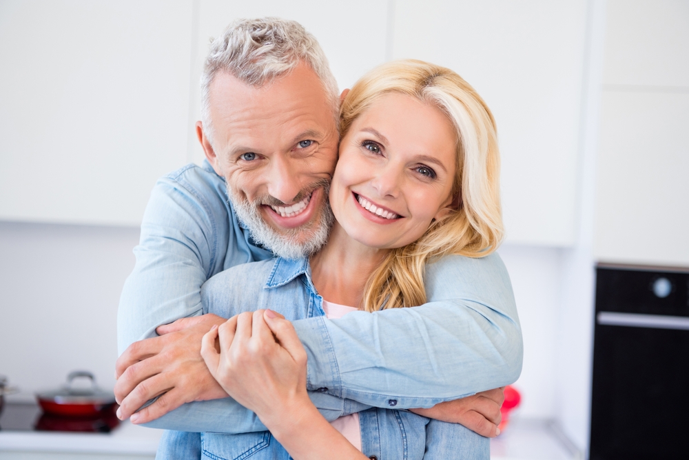 Smiling couple with healthy smiles at Griffith Dental in Port Richey FL