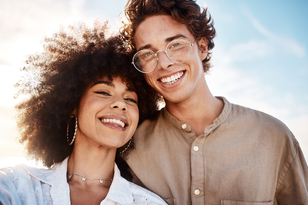 Young couple smiling with healthy teeth in Port Richey FL