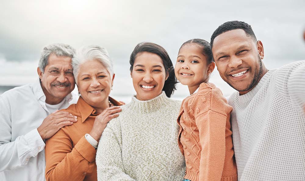 Happy family smiling after dental care at Griffith Dental